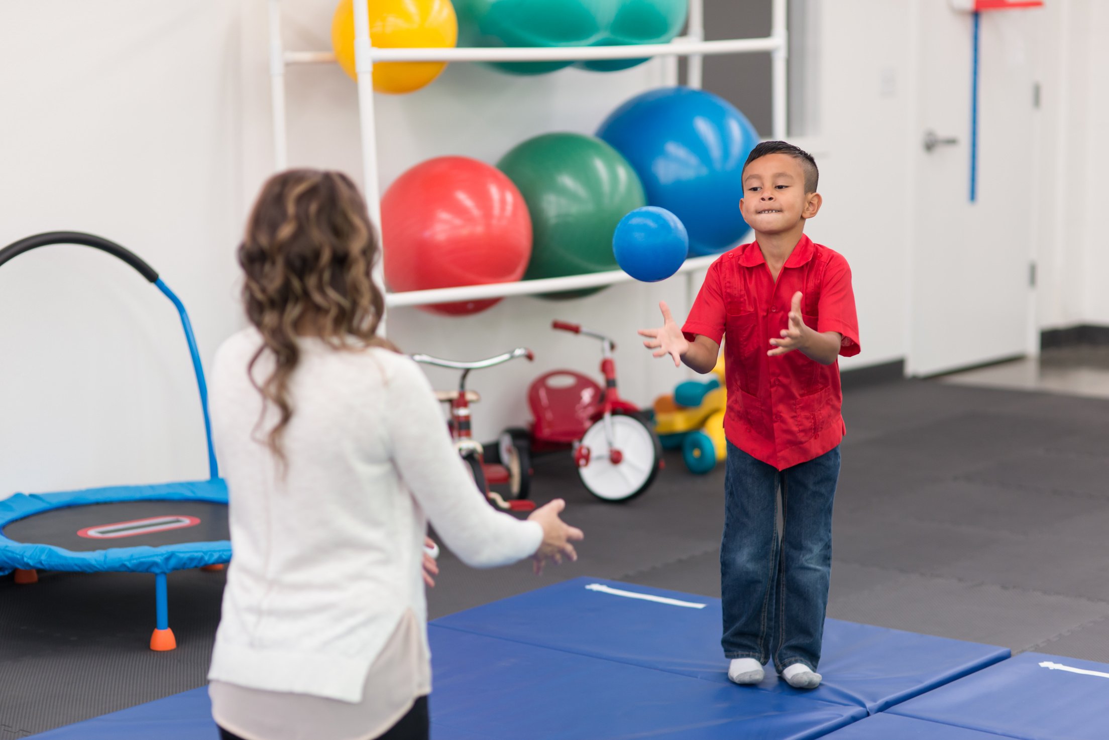 Kids exercising in physical therapy clinic